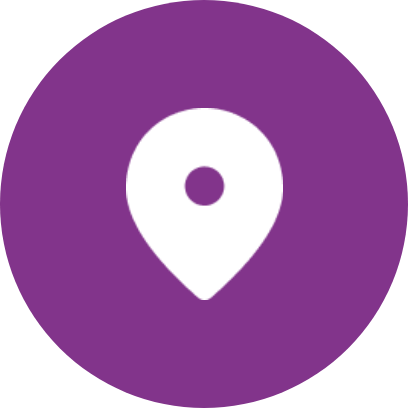 Weißes Stecknadelsymbol auf violettem, kreisförmigem Hintergrund.